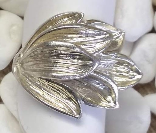 Close up detail of the fine lines on each sterling silver petal of this hand carved nature blossom ring.