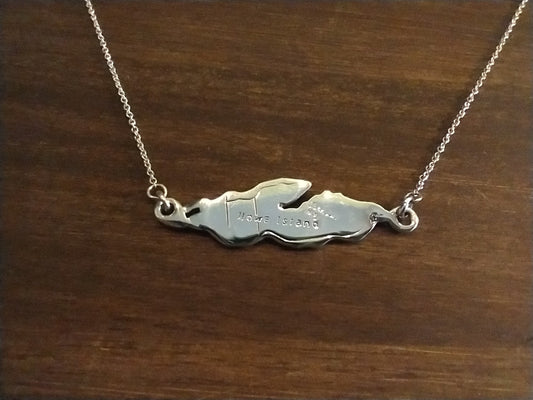 accurate outline of Howe Island in shiny sterling silver attached to a necklace chain from both ends 