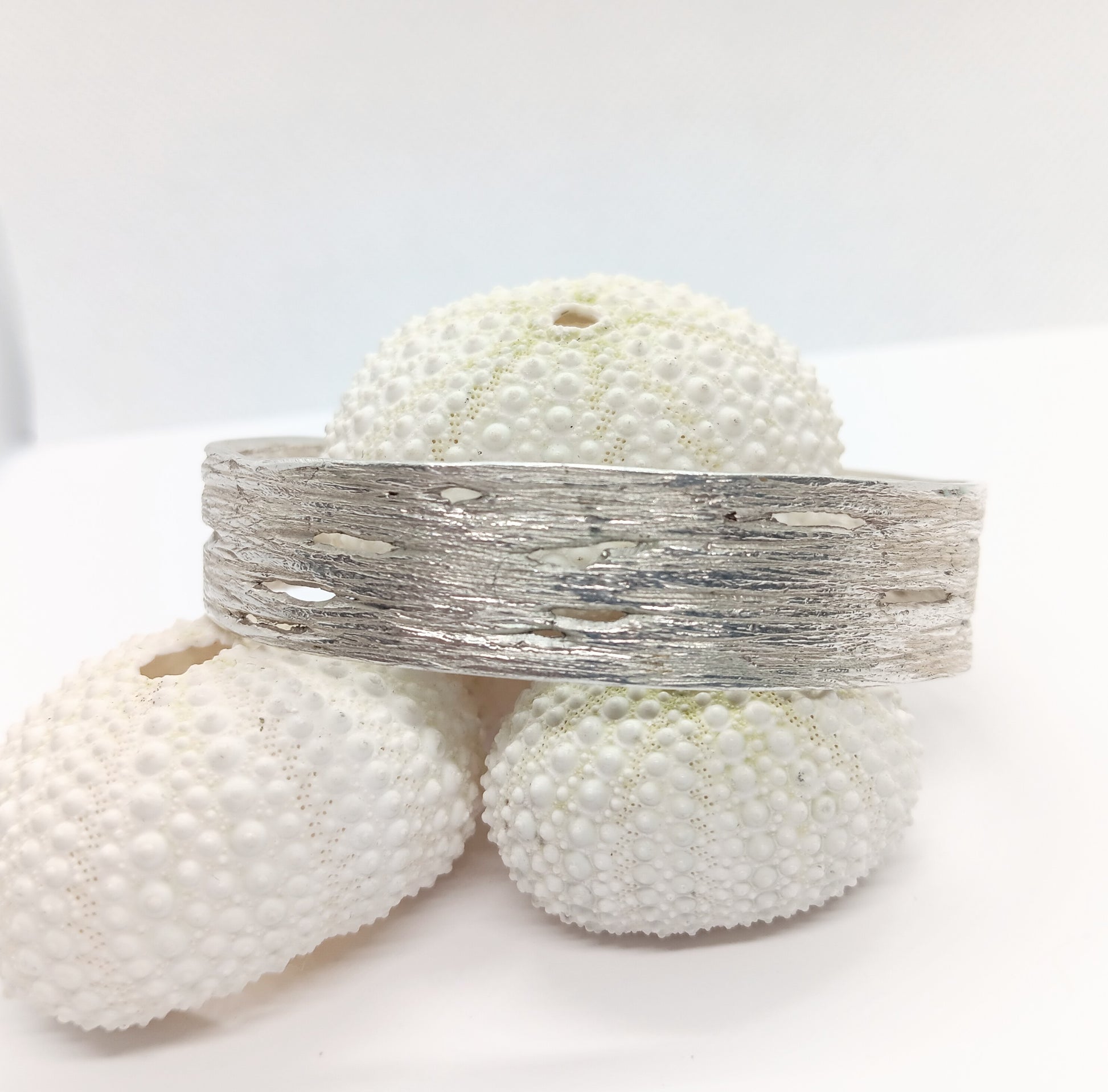 Birch bark striations and horizontal pores (lenticels) are visible on this finely crafted sterling silver bangle cast from nature