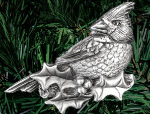 Finely detailed cast-pewter cardinal resting on a celebratory holly branch with berry cluster (palm sized, one-sided)
